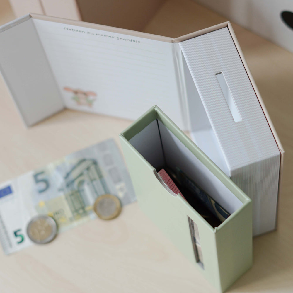 
                      
                        Modulares Spardosen-System in Buchform
                      
                    