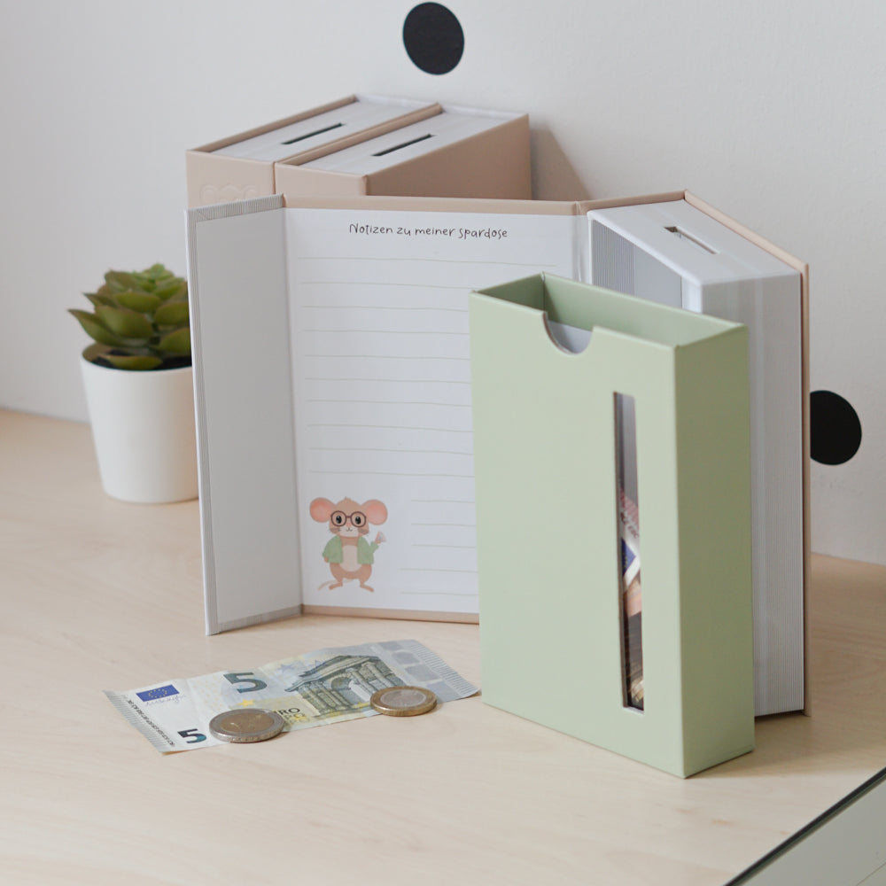 
                      
                        Modulares Spardosen-System in Buchform
                      
                    